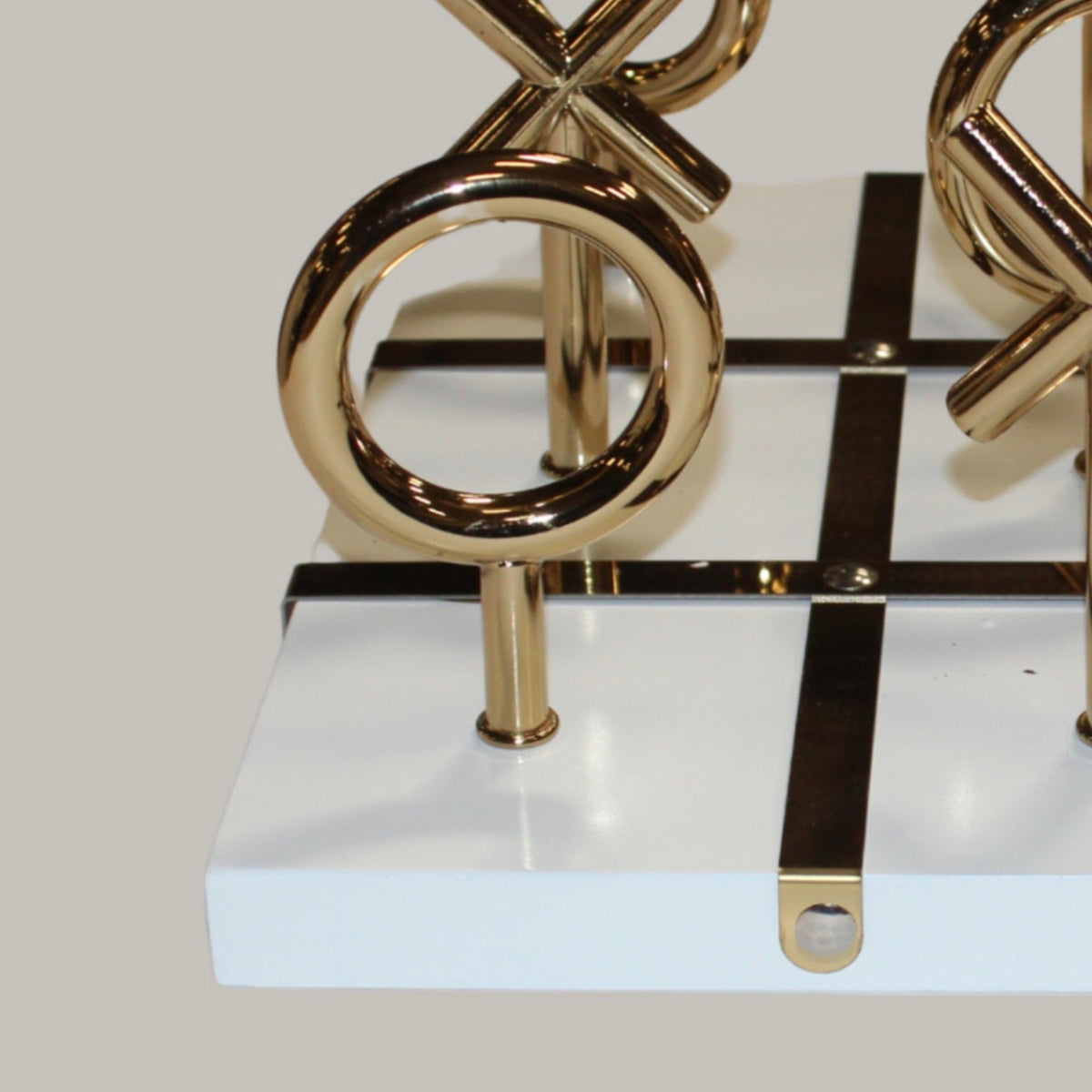 Tic-tac-toe corner detail, white board brass edge