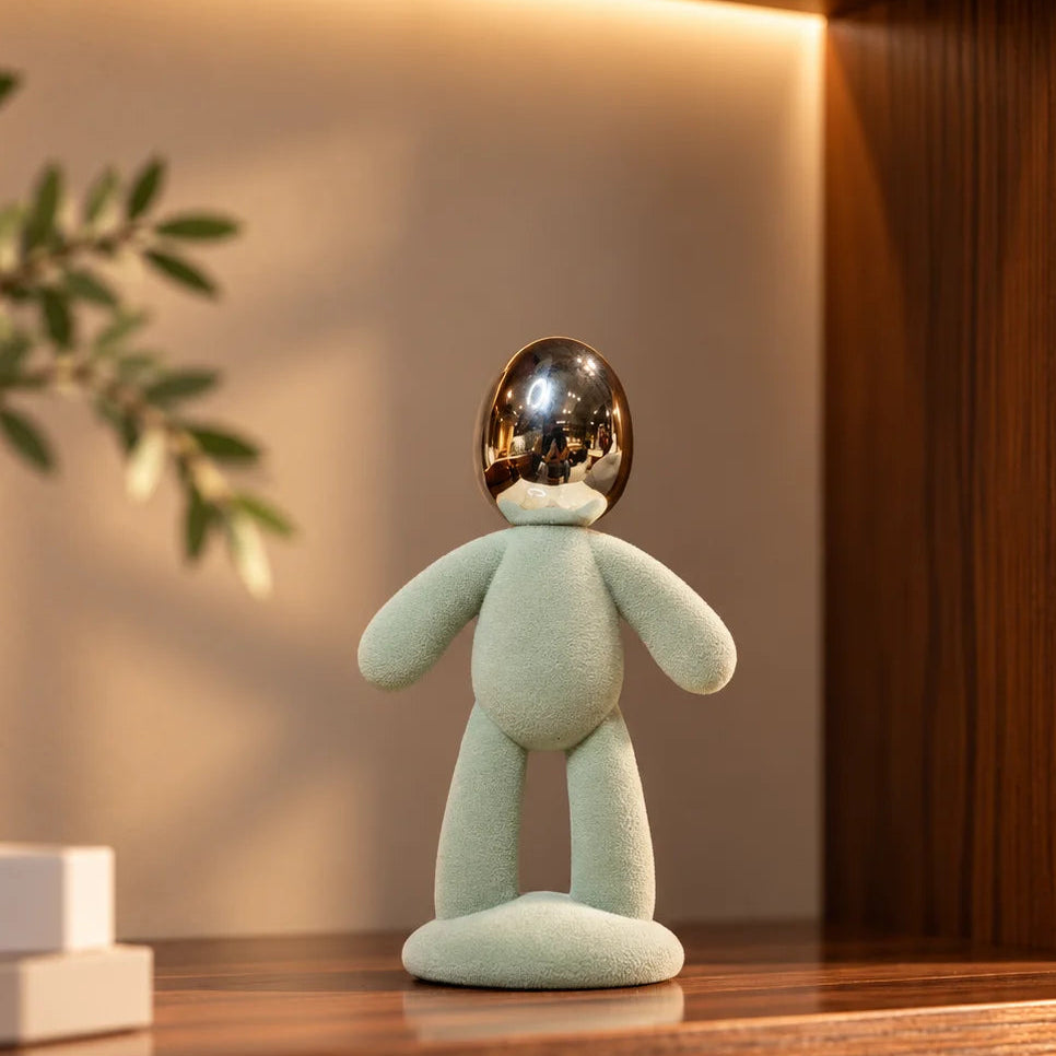 Contemporary abstract figurine with textured body and reflective metallic head