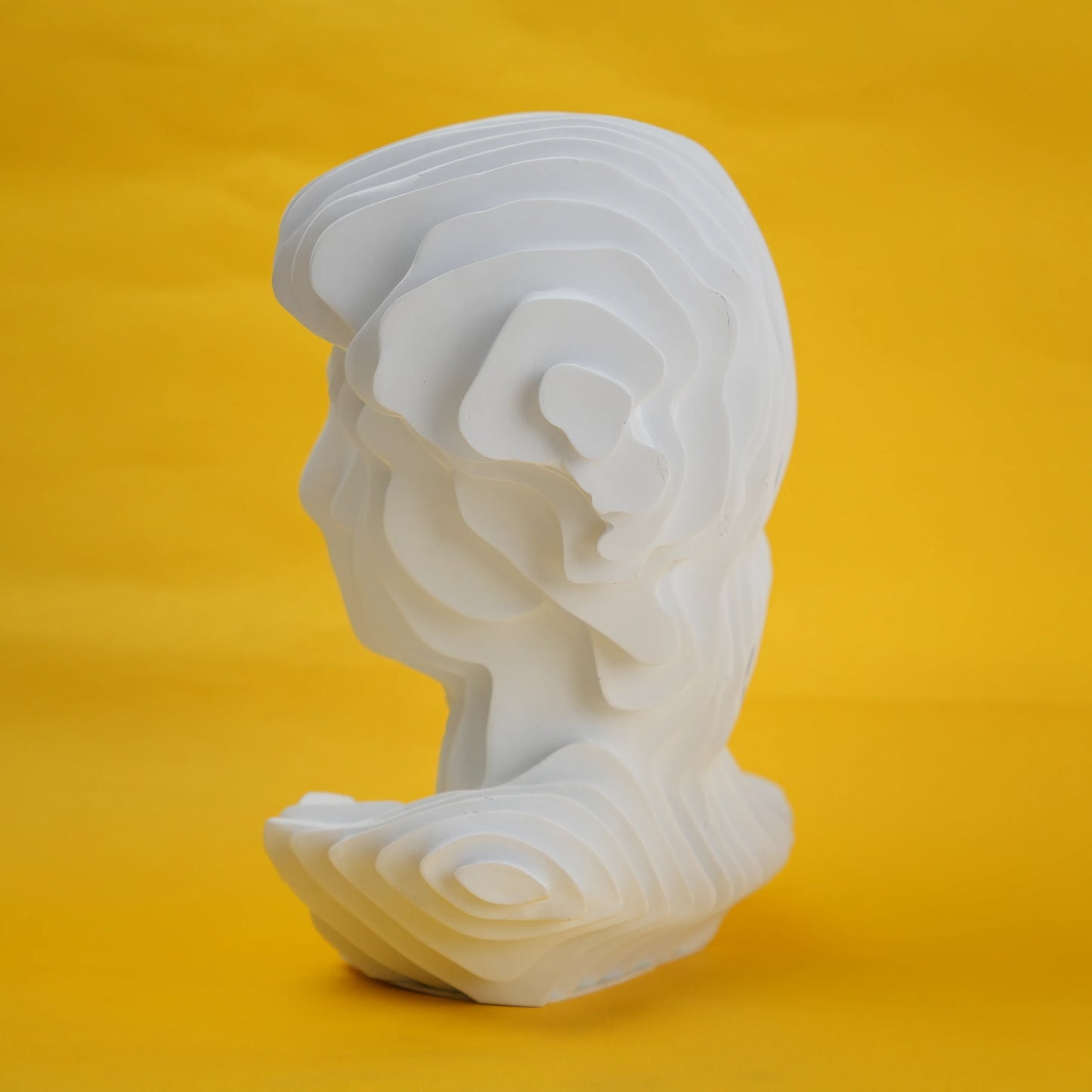 White wavy bust left side on yellow