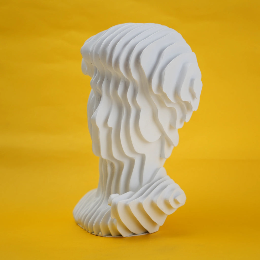 White swirled bust 3/4 on yellow paper