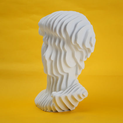 White swirled bust 3/4 on yellow paper