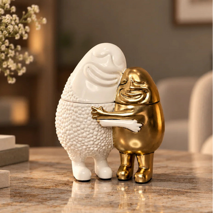 Golden Embrace Hug pair on marble table