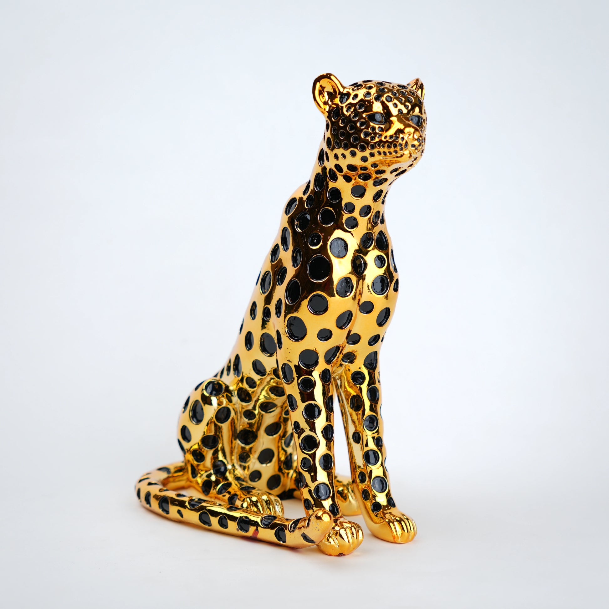 luxury leopard figurine in gold with black detailing modern decor