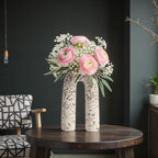 Terra Loop w/ pink ranunculus on dark wall