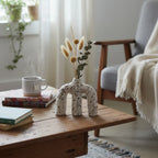 Terra Arch w/ pampas on wood coffee table