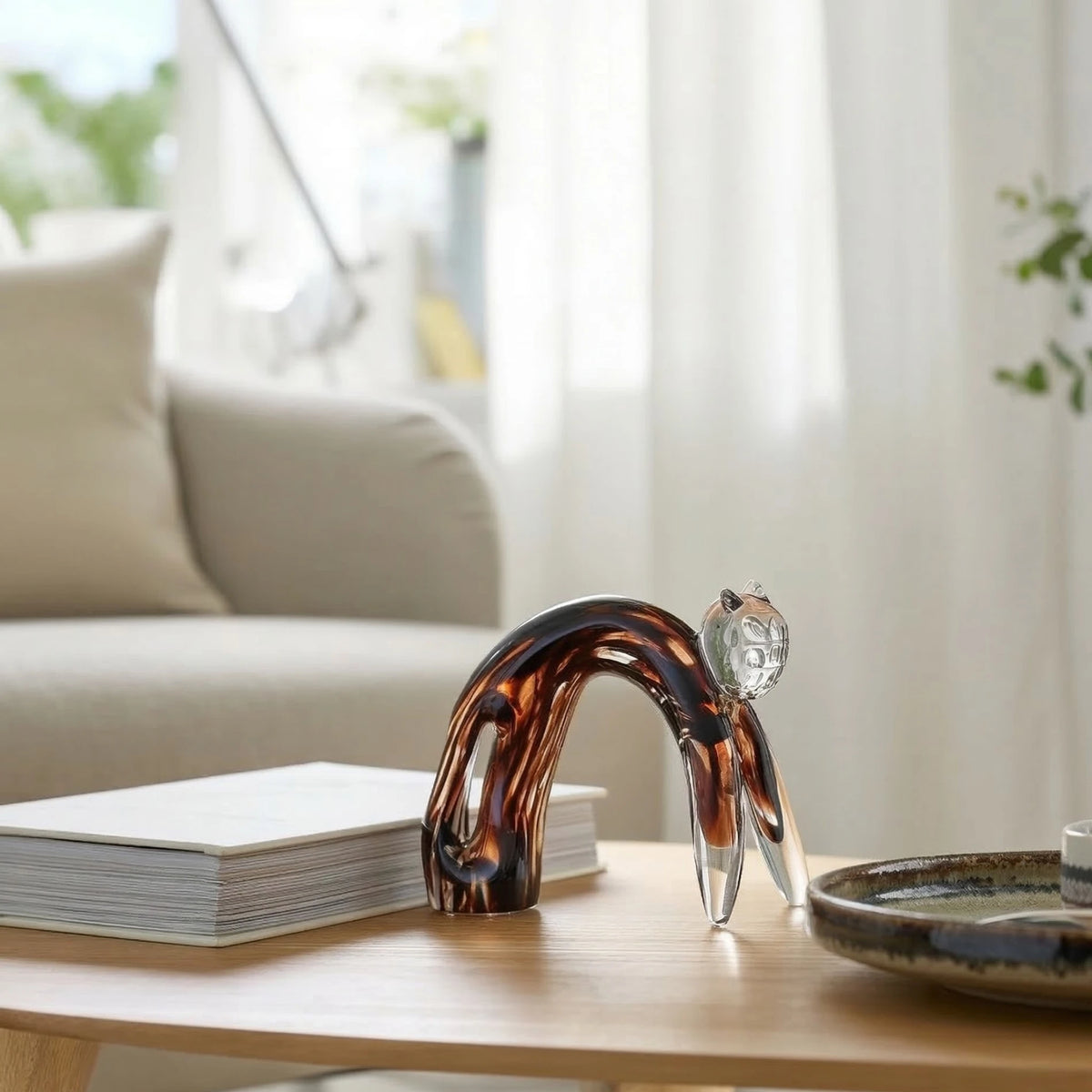 Glass cat tortoise amber on oak coffee table