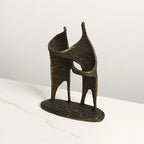 Connected forms isolated, raw bronze patina