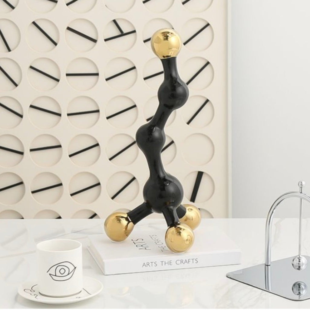 Black and gold abstract fusion form decor accent