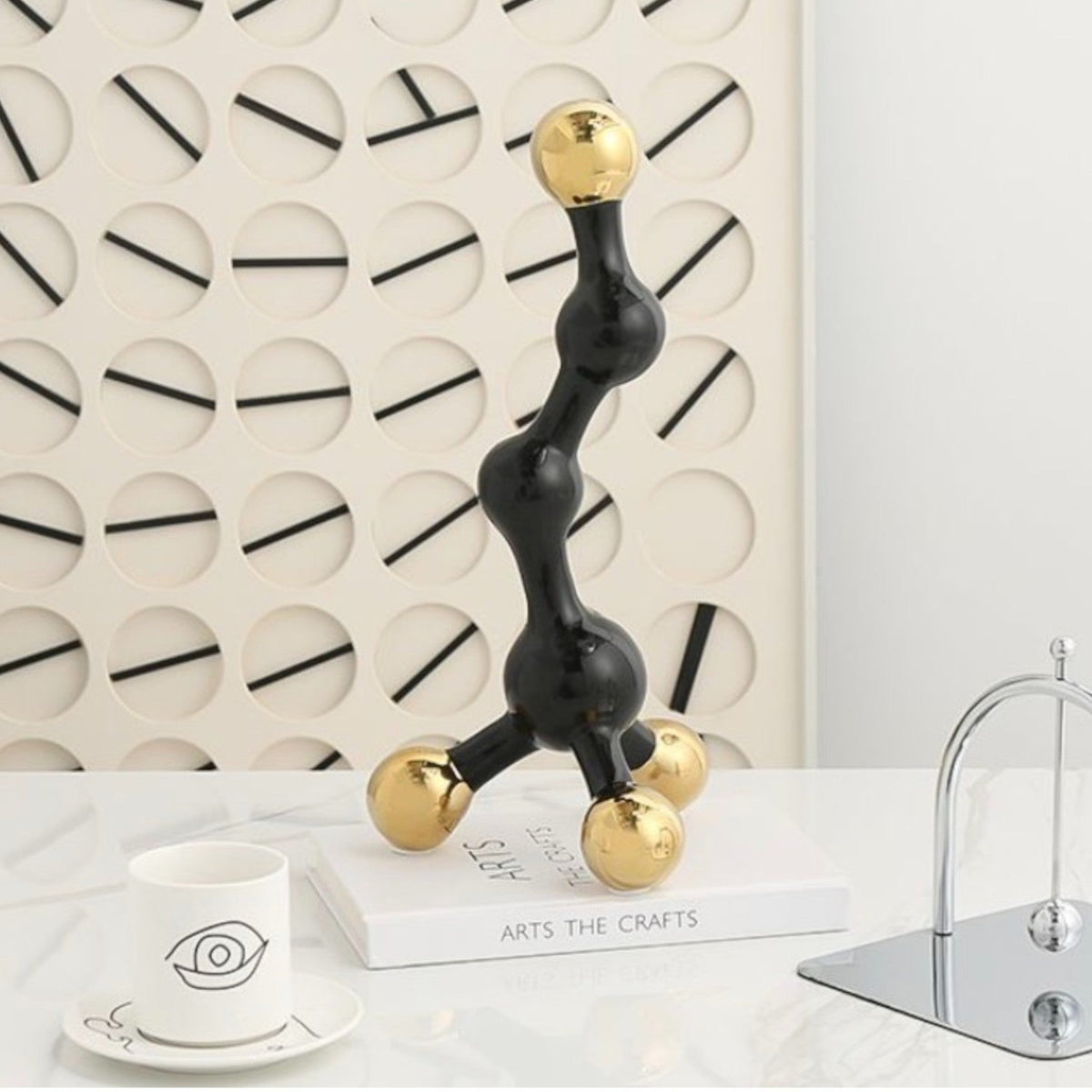 Black and gold abstract fusion form decor accent