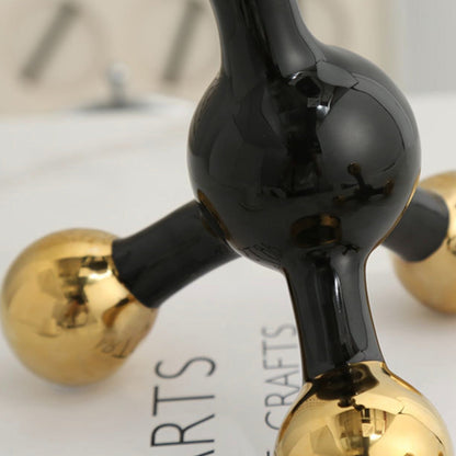 Black and gold abstract fusion form decor accent