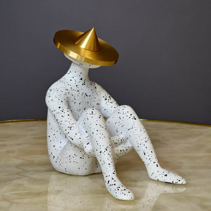 Modern abstract human figurine with artistic seated posture and metallic gold accent for luxury tabletop decor arrangements