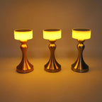 Luxury cordless LED table lamp featuring a brushed gold metal base with a minimalist white lampshade, ideal for bedside tables, restaurants, cafés, living rooms and modern designer interiors.