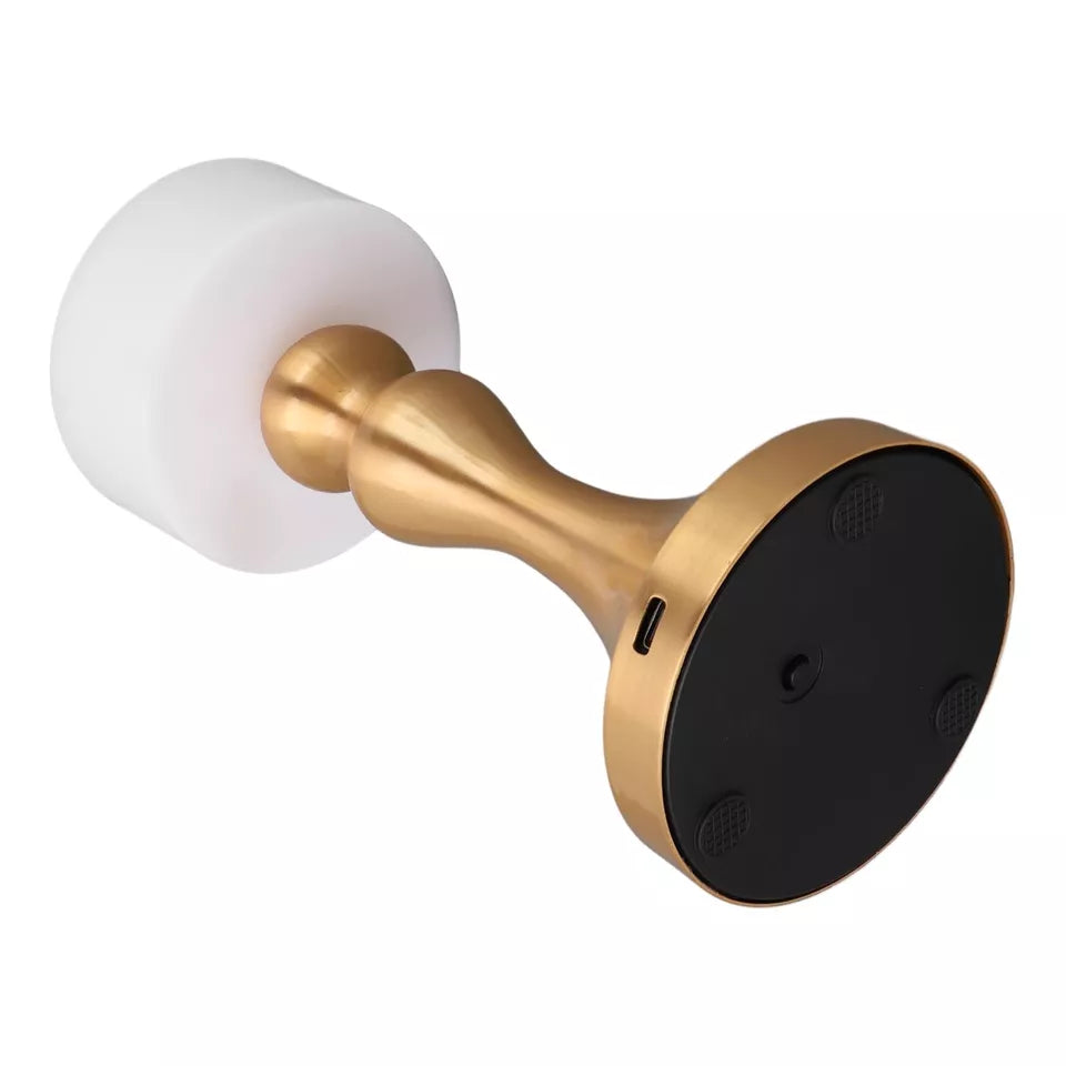 Luxury cordless LED table lamp featuring a brushed gold metal base with a minimalist white lampshade, ideal for bedside tables, restaurants, cafés, living rooms and modern designer interiors.
