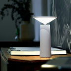 designer table lamp with sleek base and diffused lighting for interiors