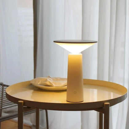 designer table lamp with sleek base and diffused lighting for interiors