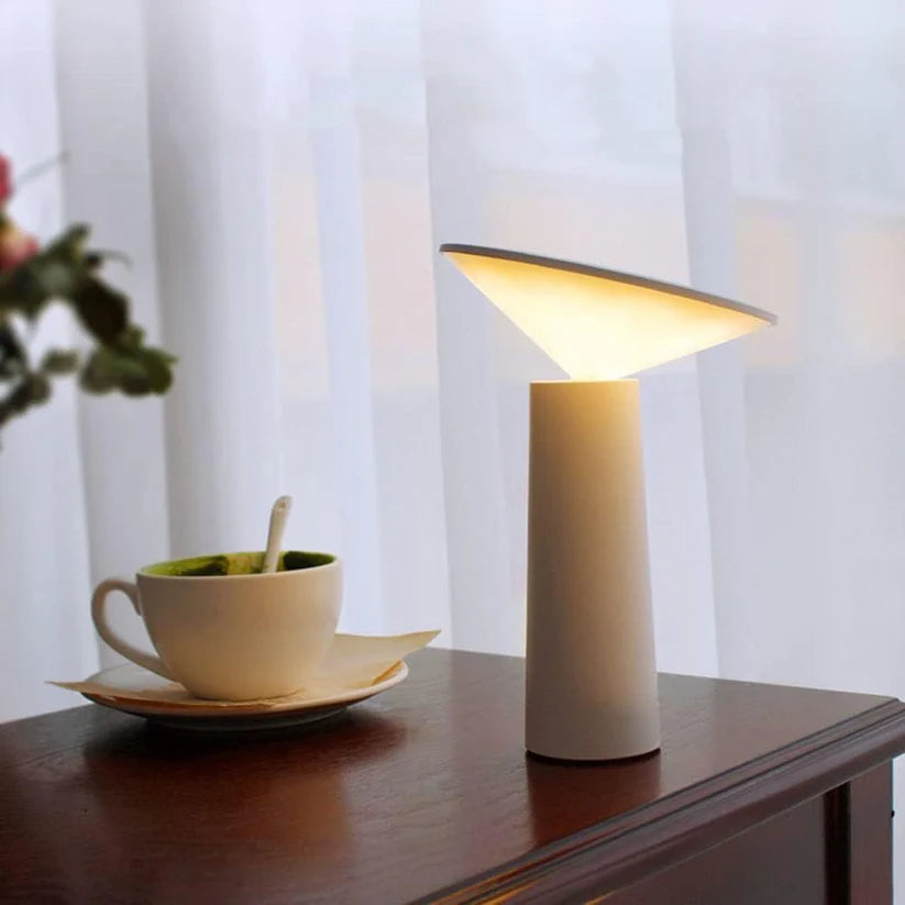 designer table lamp with sleek base and diffused lighting for interiors