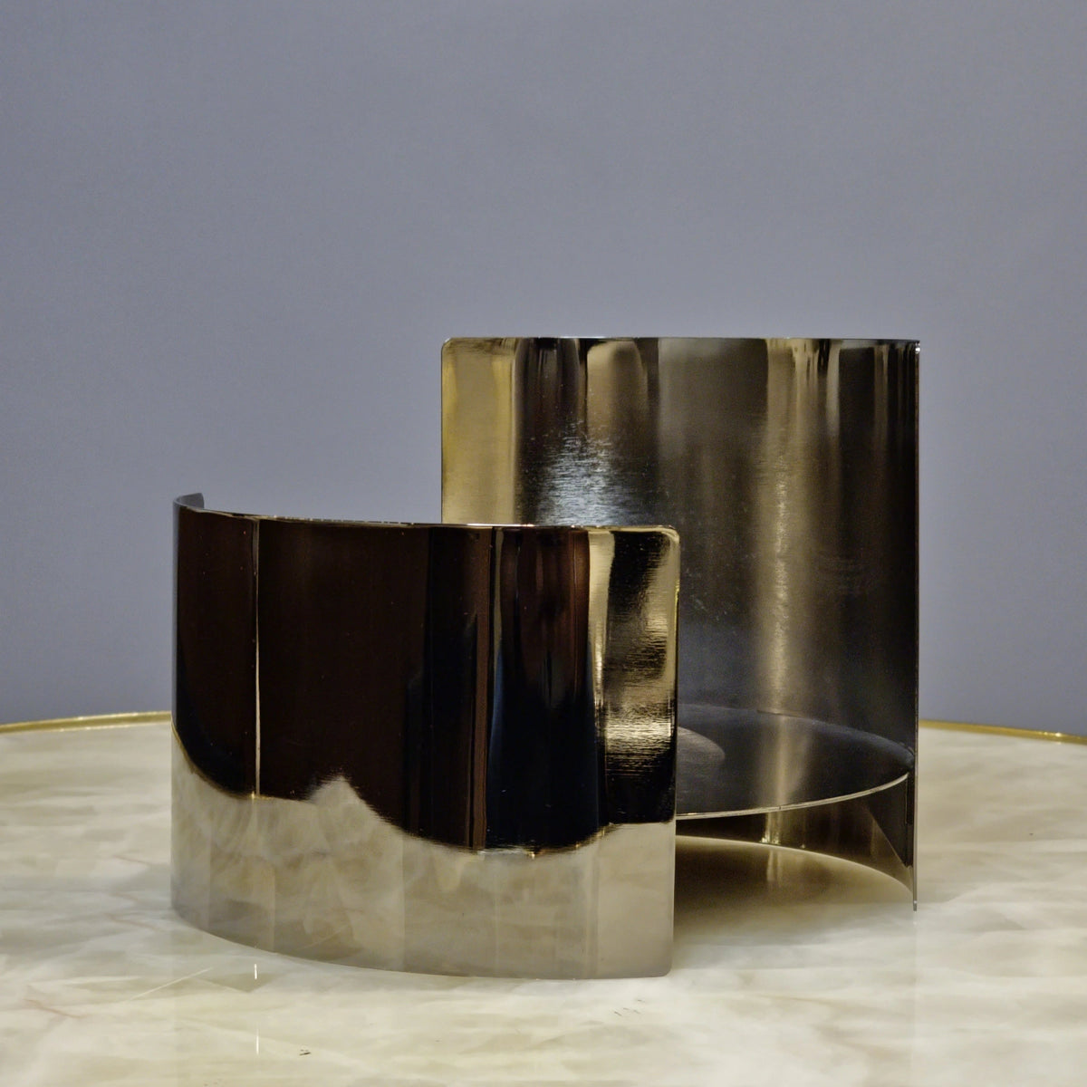 Modern decorative metal stand for sculptures and statement accents.