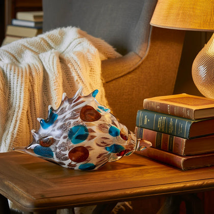 Coastal conch shell w/ books & lamp, lifestyle