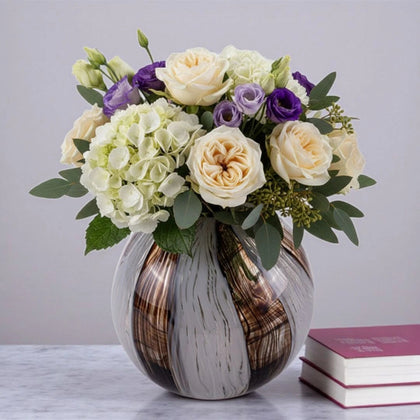 Radiant striped sphere vase w/ rose bouquet