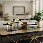 Ascend Form on bronze table w/ books & plant