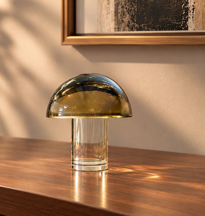 Luxury mushroom-inspired smoked glass décor accent featuring a tinted glass dome and clear cylindrical glass base, perfect for coffee tables, console tables, bookshelves and modern designer interiors.