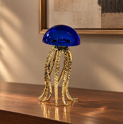 Decorative jellyfish figurine with cobalt blue glass dome and metallic tentacle details.