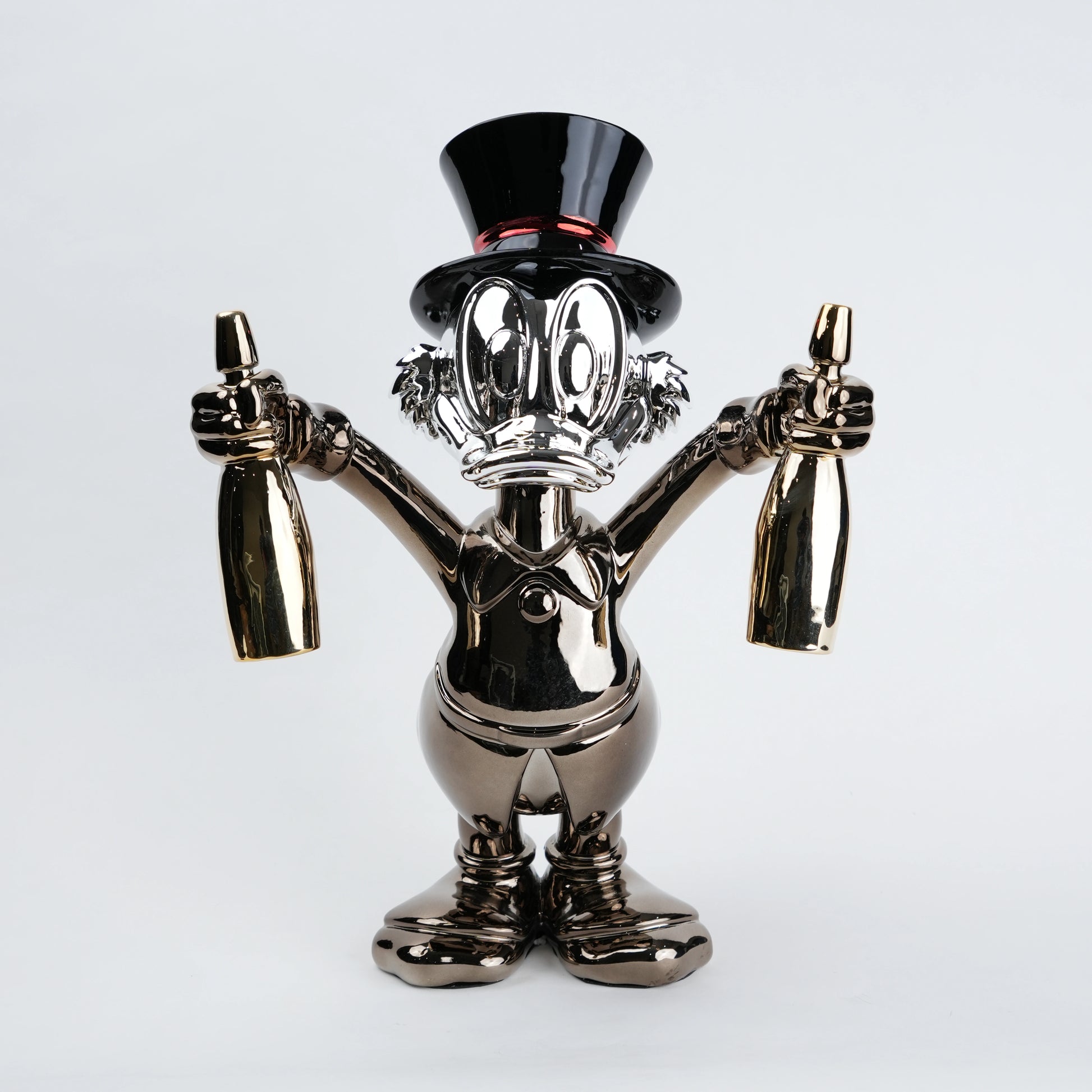 metallic duck figurine holding champagne bottles modern quirky home decor