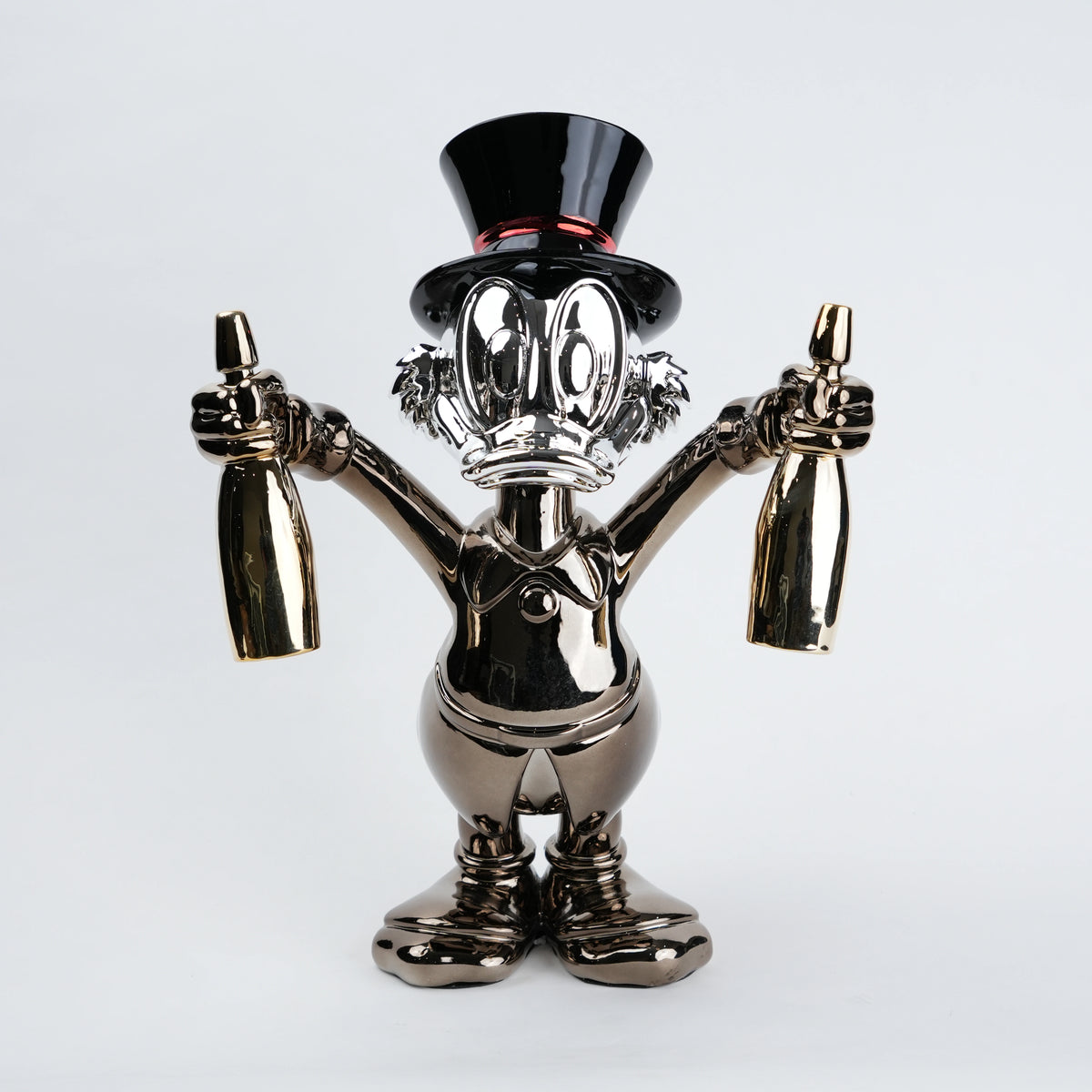 metallic duck figurine holding champagne bottles modern quirky home decor