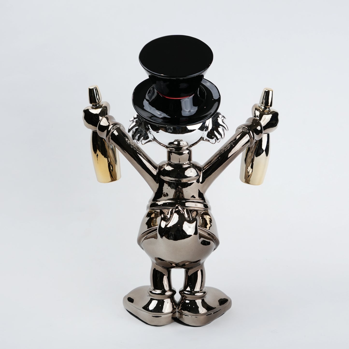 metallic duck figurine holding champagne bottles modern quirky home decor