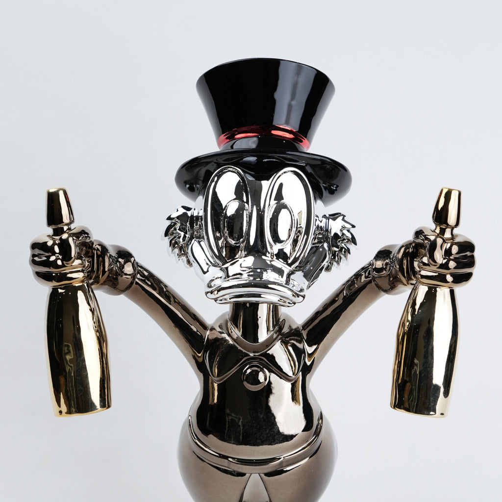 metallic duck figurine holding champagne bottles modern quirky home decor