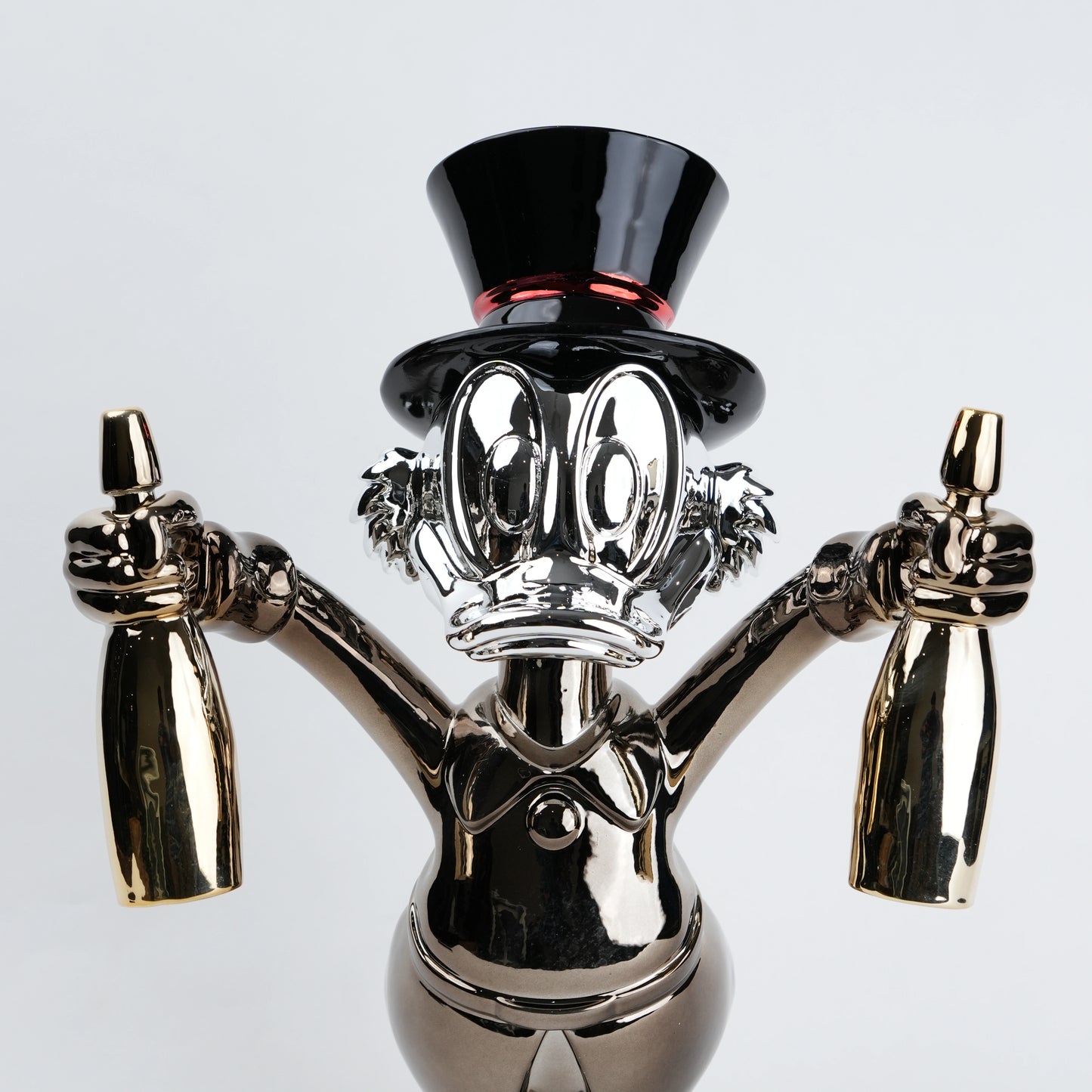 metallic duck figurine holding champagne bottles modern quirky home decor