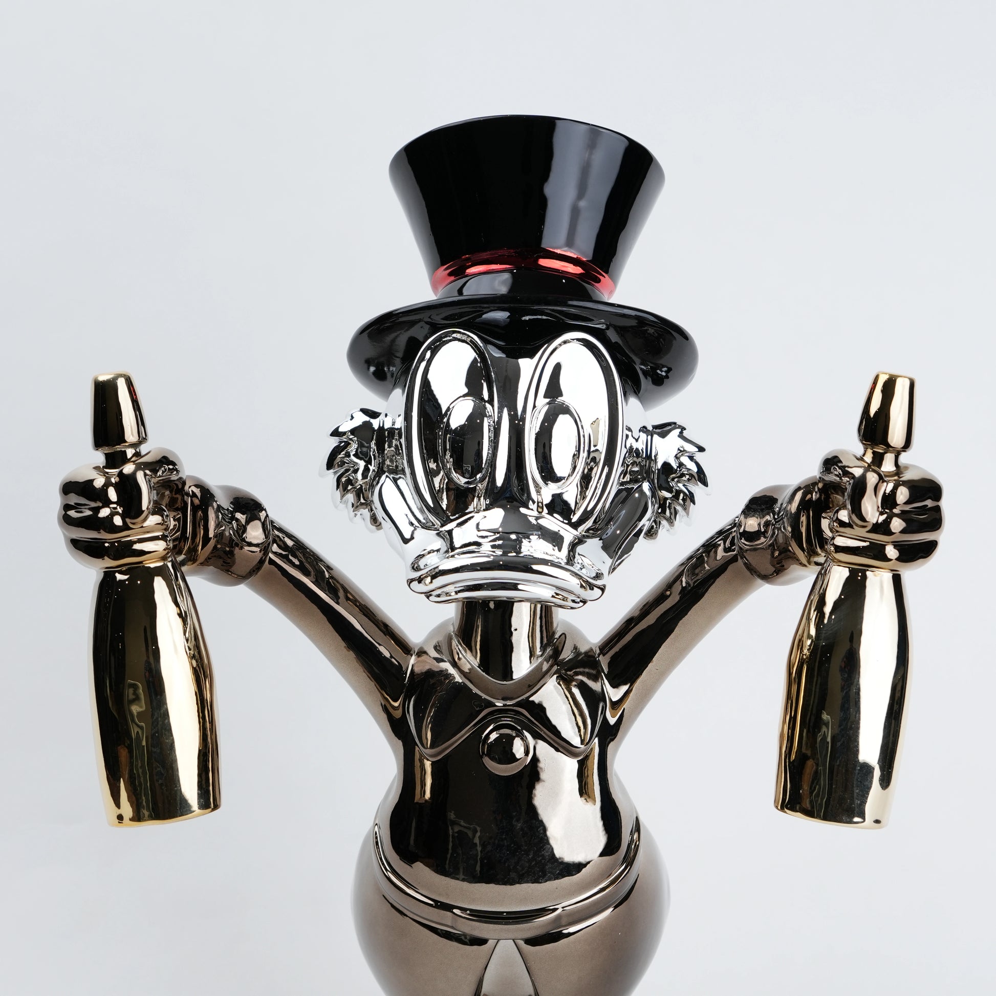metallic duck figurine holding champagne bottles modern quirky home decor