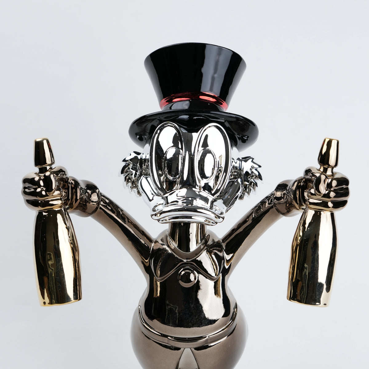 metallic duck figurine holding champagne bottles modern quirky home decor