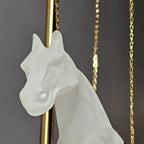 Gold galloping horse decor inside black frame tabletop display
