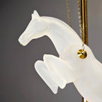 Gold galloping horse decor inside black frame tabletop display