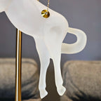 Gold galloping horse decor inside black frame tabletop display