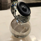 Luxury crystal decorative accent featuring a faceted crystal element balanced on a smoked crystal sphere with contemporary geometric styling, ideal for coffee tables, consoles, offices and modern designer interiors.