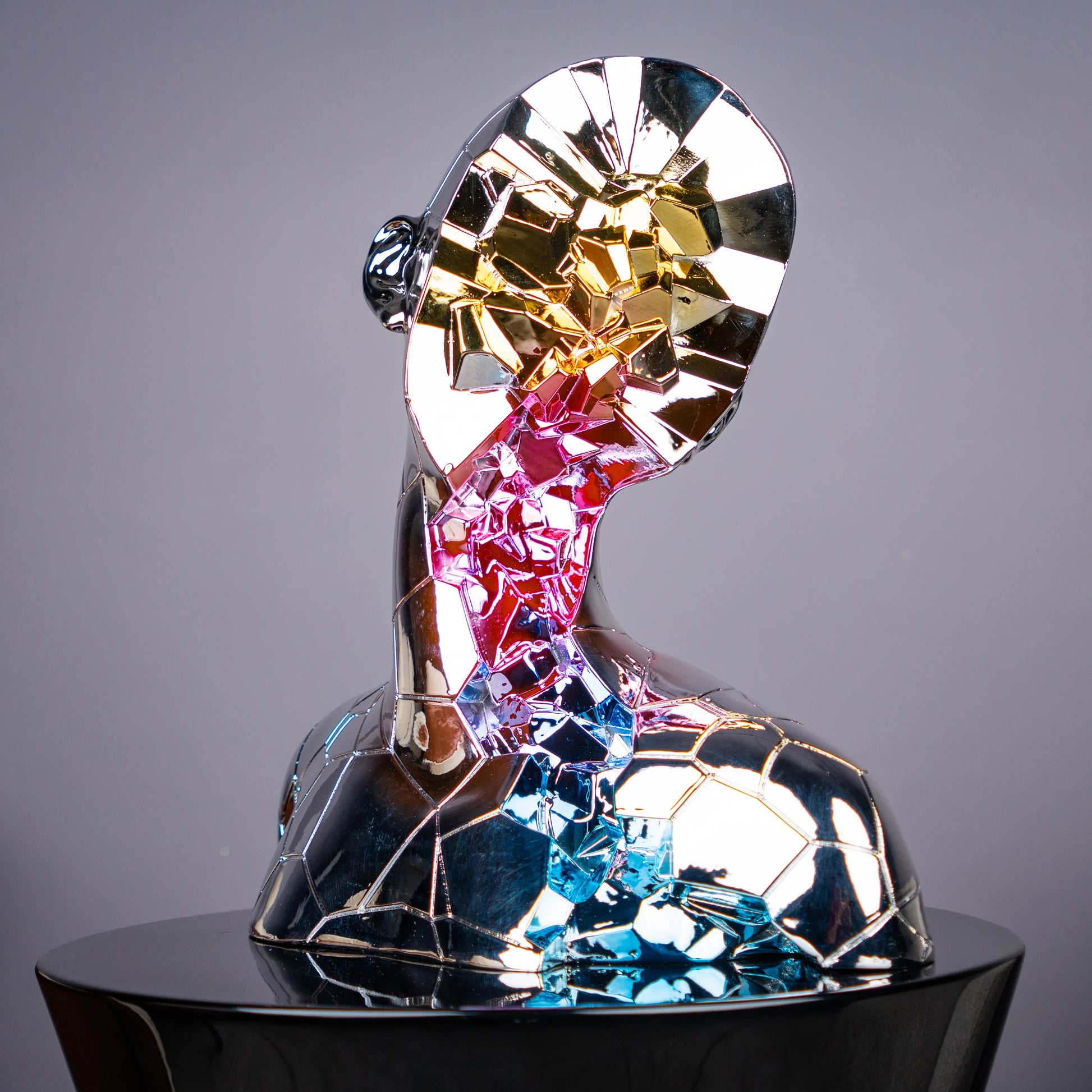 chrome silver abstract human bust with multicolor mosaic accents