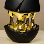 Black and gold modern decor accent with open core design