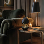 Gilded core egg by candle & dark lamp