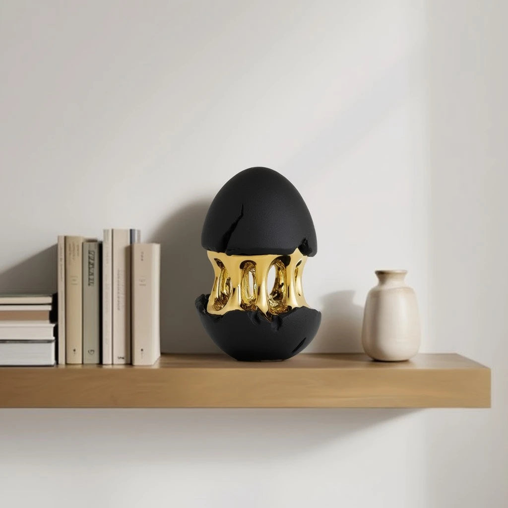 Gilded core egg on oak shelf w/ books