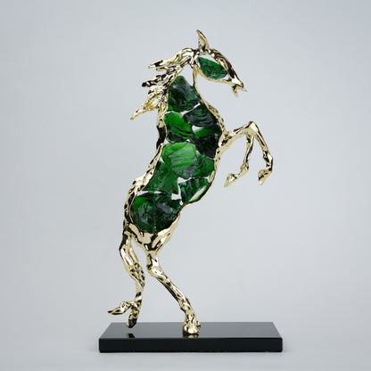 Emerald crystal horse sculpture with gold finish in dynamic galloping form