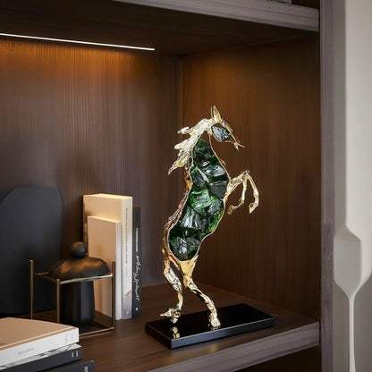 Emerald crystal horse sculpture with gold finish in dynamic galloping form