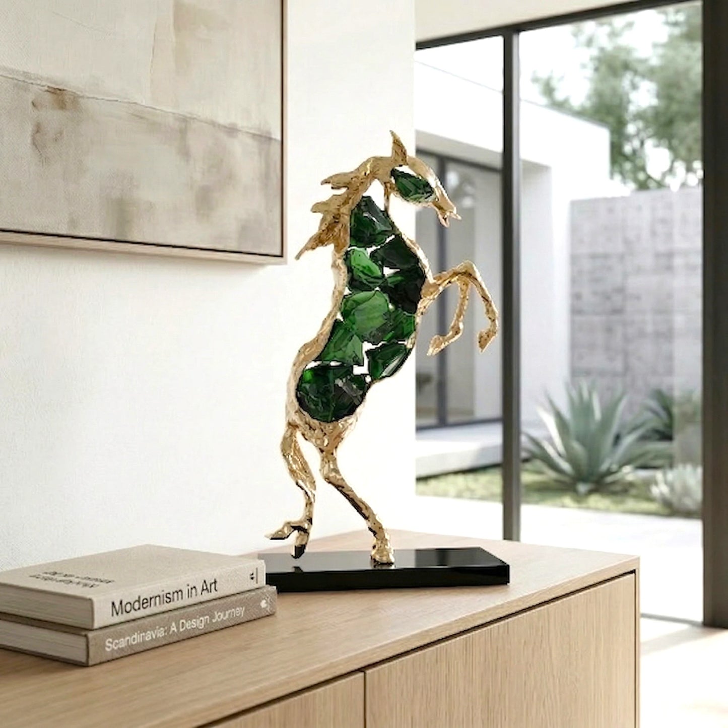 Emerald crystal horse sculpture with gold finish in dynamic galloping form