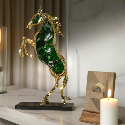 Emerald crystal horse sculpture with gold finish in dynamic galloping form