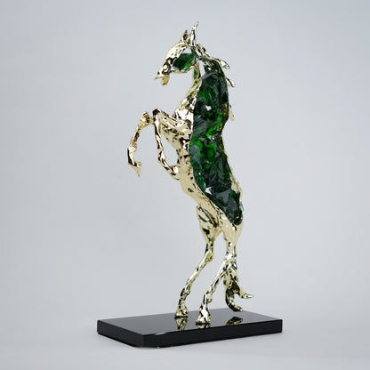 Emerald crystal horse sculpture with gold finish in dynamic galloping form