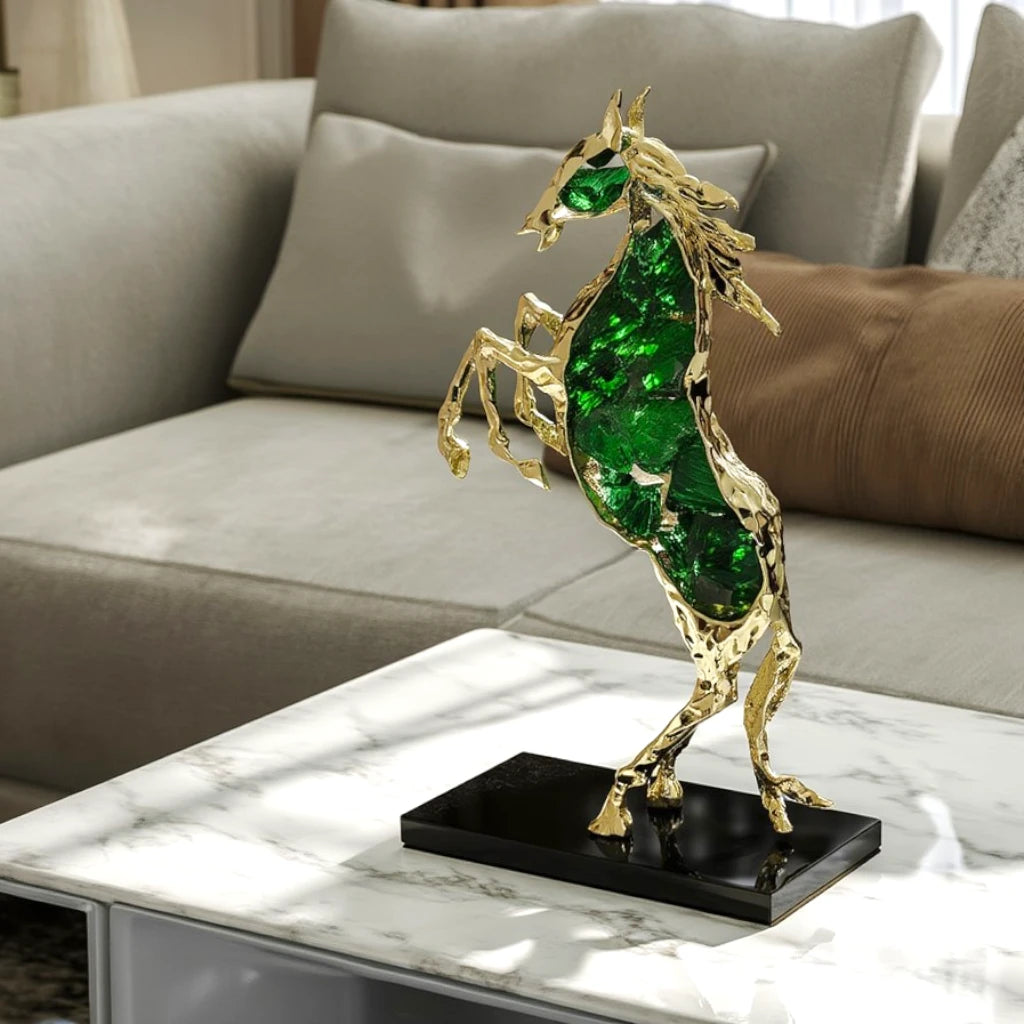 Emerald crystal horse sculpture with gold finish in dynamic galloping form