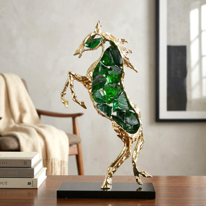 Emerald crystal horse sculpture with gold finish in dynamic galloping form