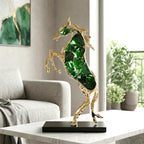 Emerald crystal horse sculpture with gold finish in dynamic galloping form