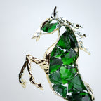 Emerald crystal horse sculpture with gold finish in dynamic galloping form